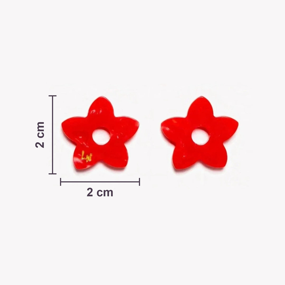 Dimensioni reali dei charms Tiaré Acetato: 2 cm di diametro